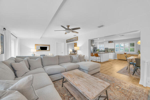 102 Pineview Road Jupiter, FL 33469 - Photo 15 of 34 a living room with furniture and a large window