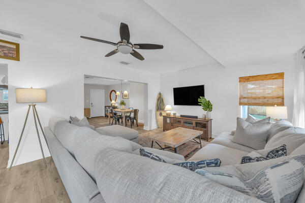 102 Pineview Road Jupiter, FL 33469 - Photo 16 of 34 a living room with furniture and a flat screen tv