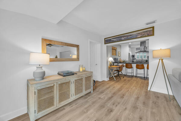 102 Pineview Road Jupiter, FL 33469 - Photo 18 of 34 a living room with furniture and a wooden floor