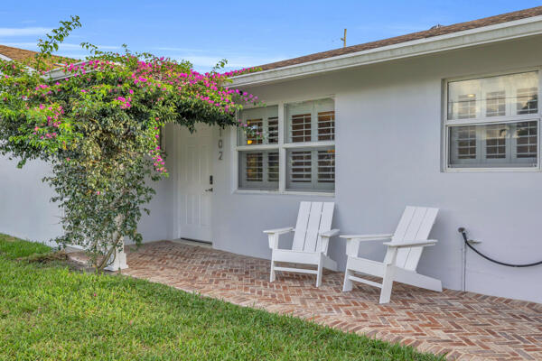 102 Pineview Road Jupiter, FL 33469 - Photo 3 of 34 a view of a house with a yard and sitting area