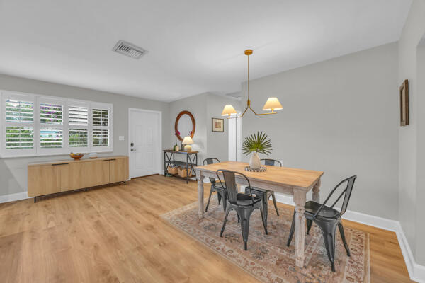 102 Pineview Road Jupiter, FL 33469 - Photo 6 of 34 a view of a dining room with furniture window and outside view