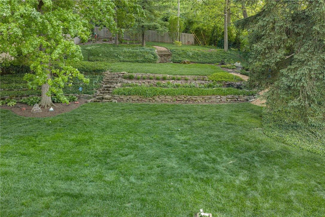 156 West Hadley Road Dayton, OH 45419 - Photo 65 of 71 This verdant outdoor space offers a private sanctuary with tiered landscaping and natural stone accents.