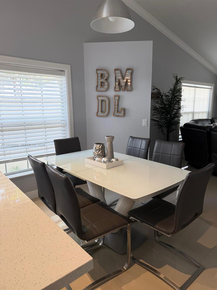 10285 Allegro Drive Boca Raton, FL 33428 - Photo 18 of 55 a view of a dining room with furniture and window