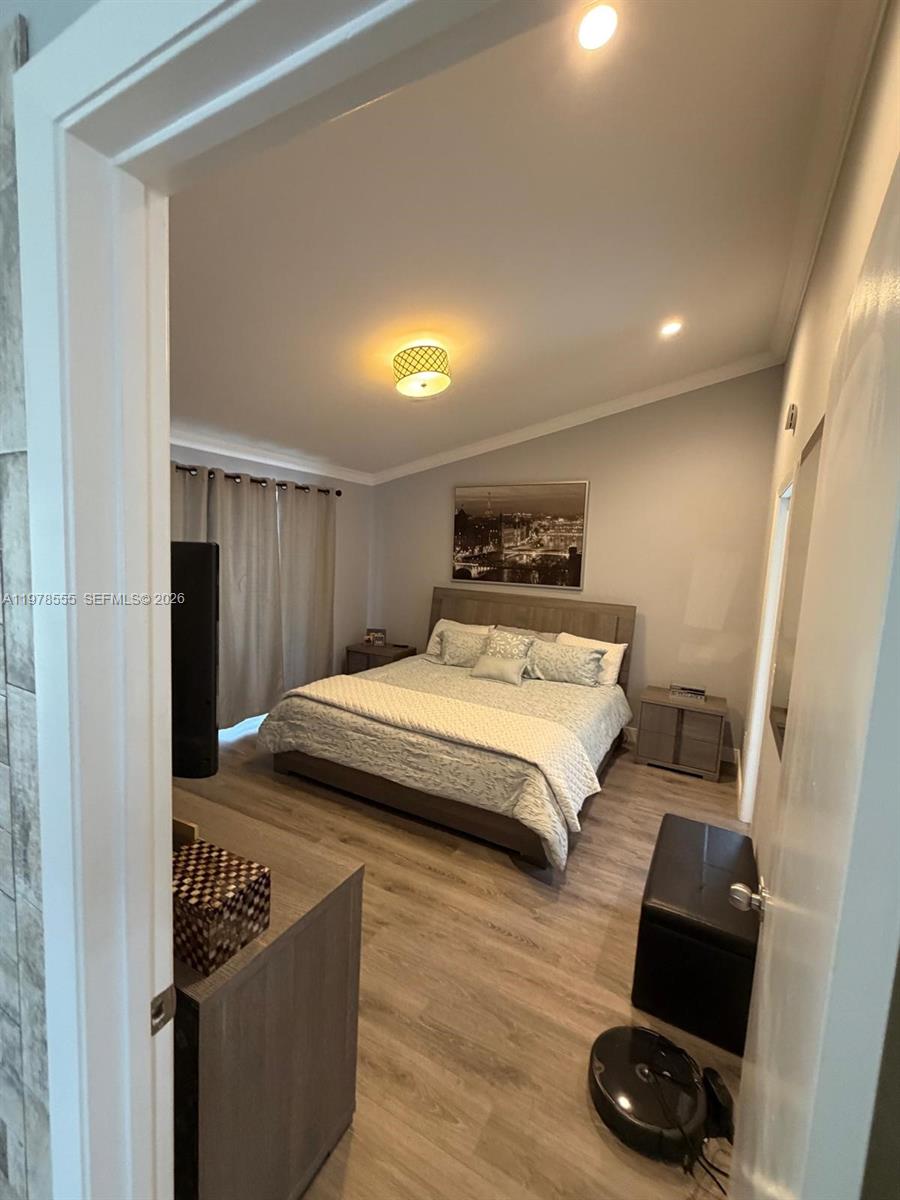 10285 Allegro Drive Boca Raton, FL 33428 - Photo 19 of 55 a bed room with a bed and a window