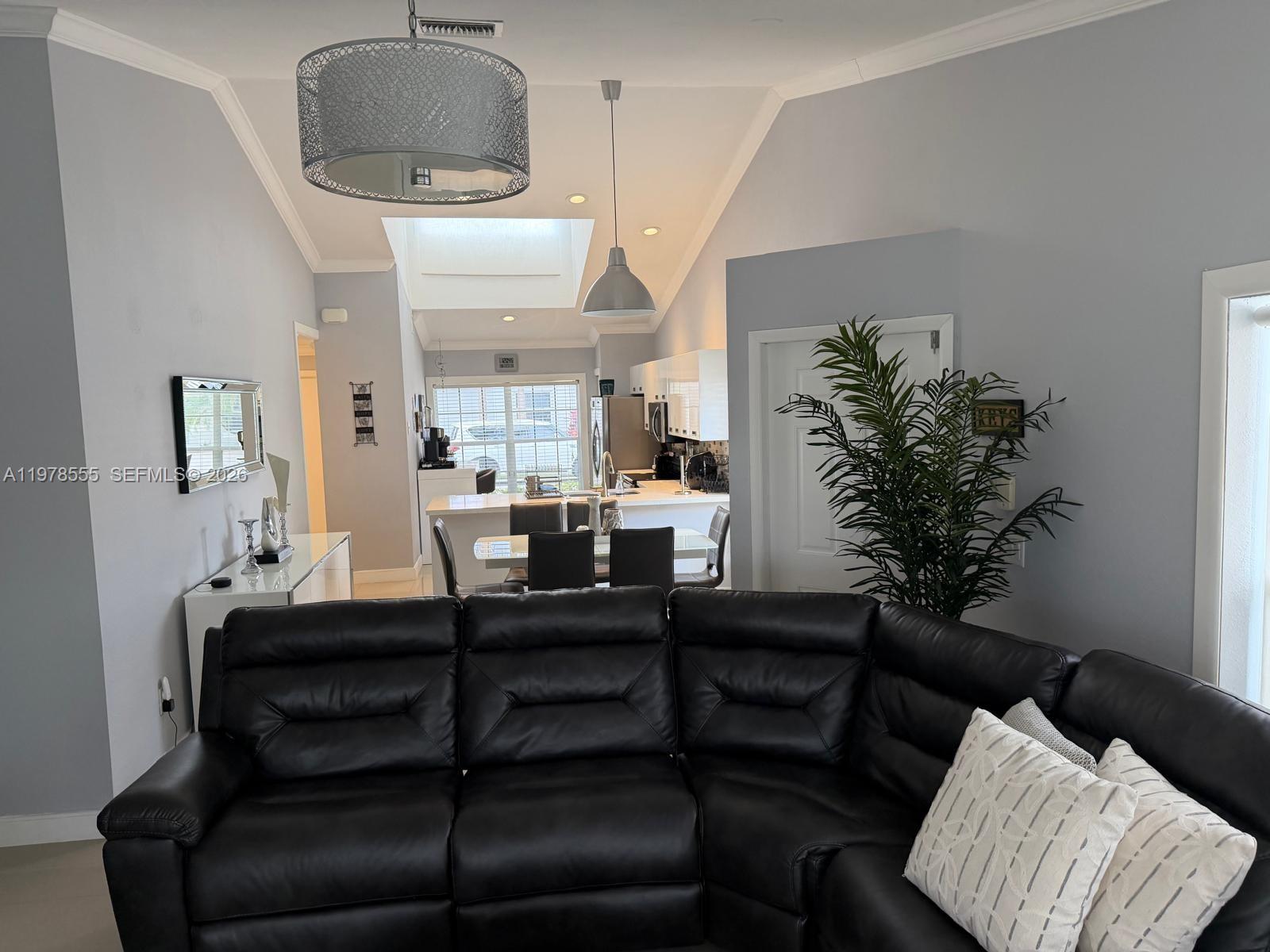 10285 Allegro Drive Boca Raton, FL 33428 - Photo 20 of 55 a living room with furniture and a potted plant