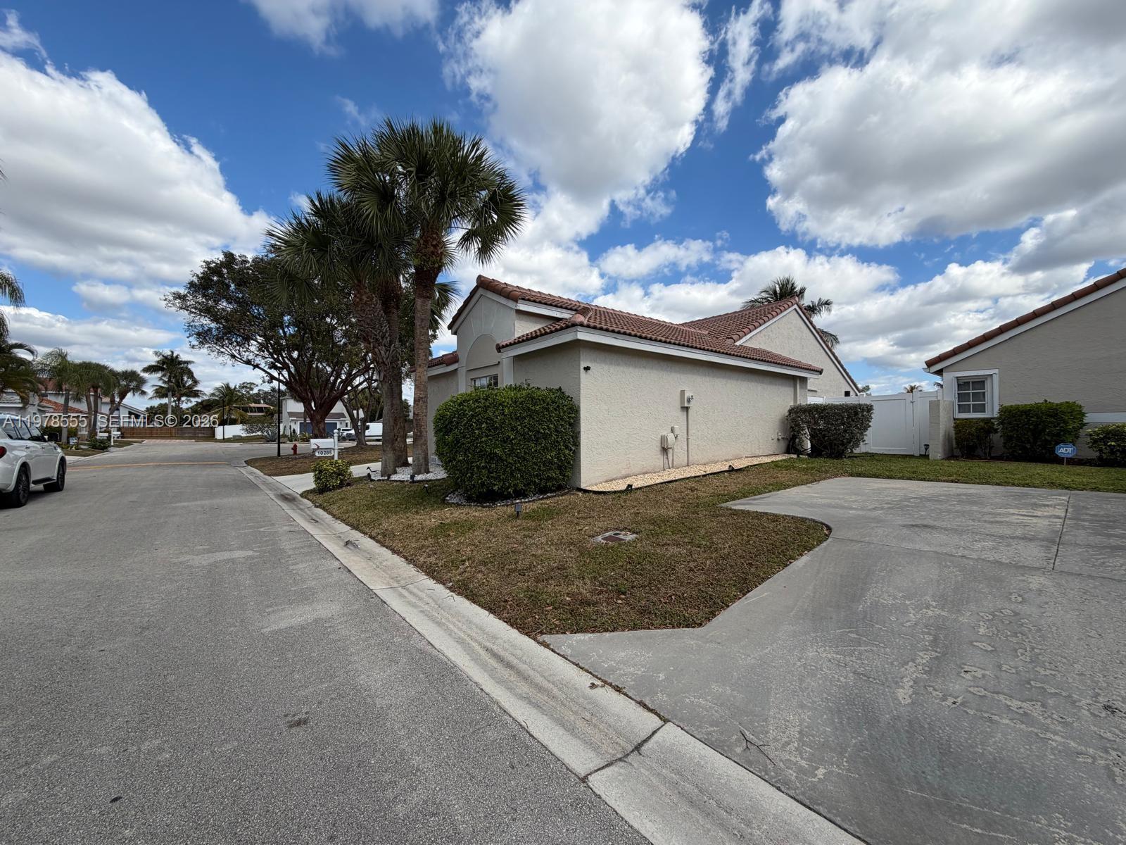 10285 Allegro Drive Boca Raton, FL 33428 - Photo 2 of 55 a view of street with parked cars