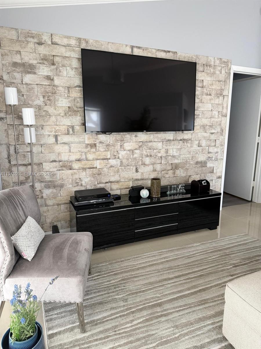 10285 Allegro Drive Boca Raton, FL 33428 - Photo 21 of 55 a living room with a flat screen tv and a fireplace