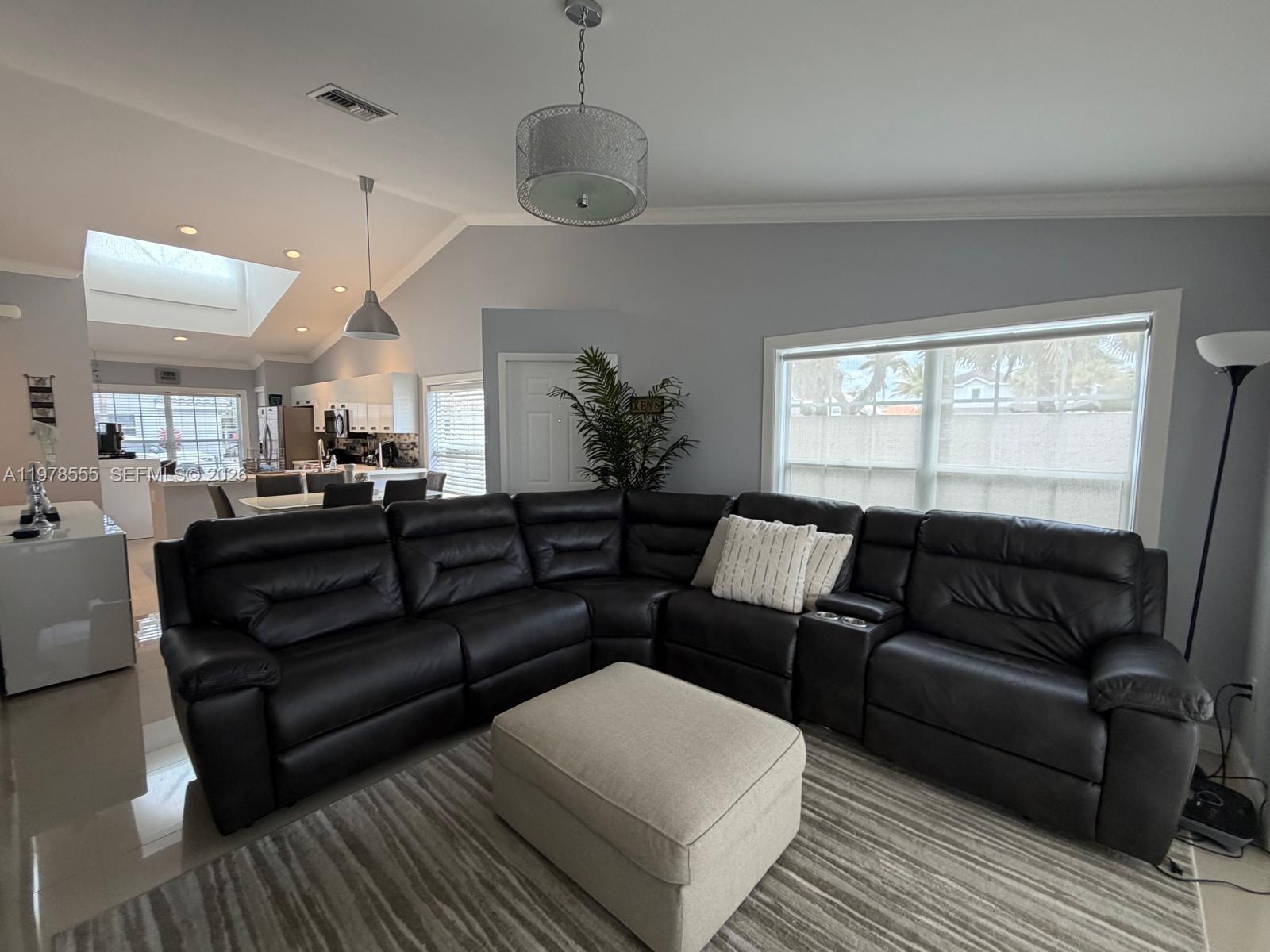 10285 Allegro Drive Boca Raton, FL 33428 - Photo 22 of 55 a living room with furniture and a potted plant