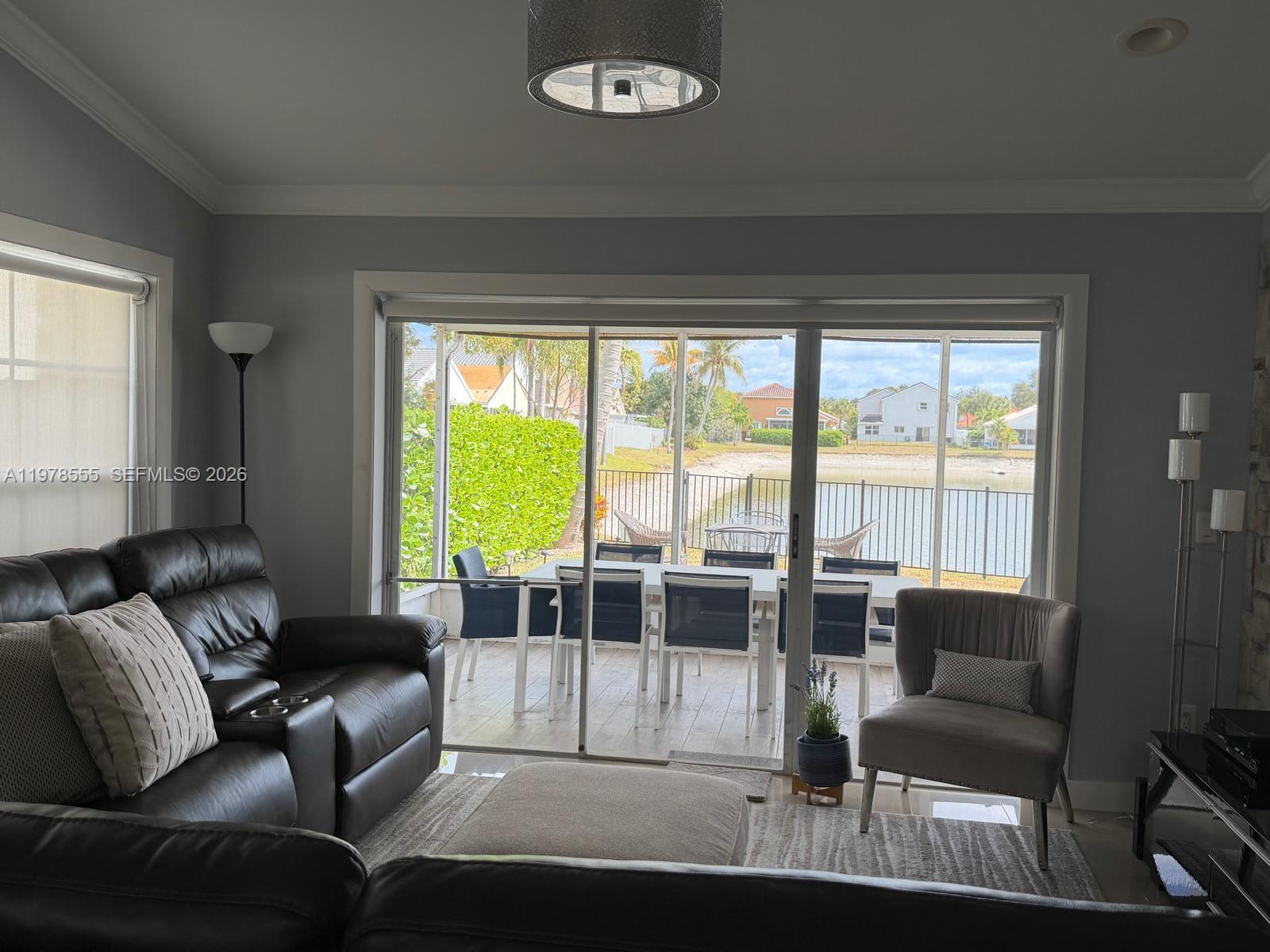 10285 Allegro Drive Boca Raton, FL 33428 - Photo 23 of 55 a living room with furniture and a large window