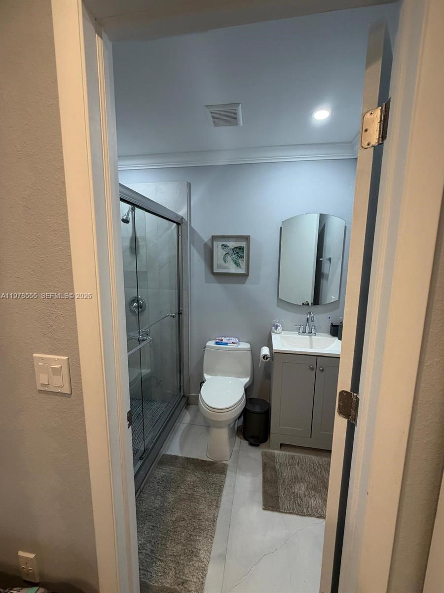 10285 Allegro Drive Boca Raton, FL 33428 - Photo 26 of 55 a bathroom with a sink toilet and shower