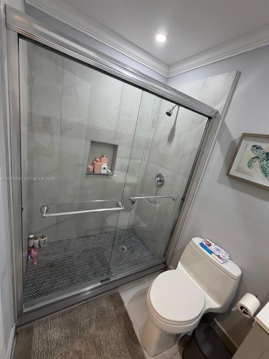 10285 Allegro Drive Boca Raton, FL 33428 - Photo 27 of 55 a bathroom with a toilet and a shower