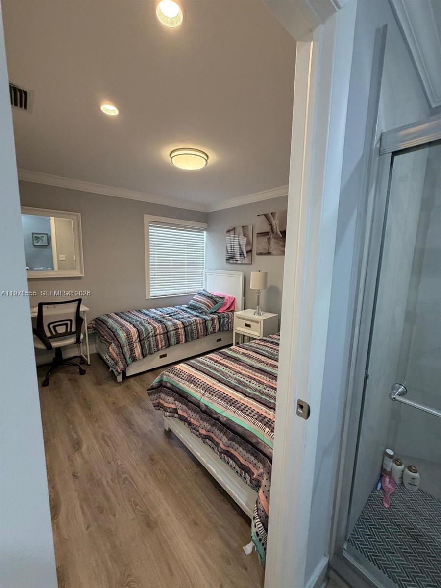 10285 Allegro Drive Boca Raton, FL 33428 - Photo 30 of 55 a bedroom with two beds and a window