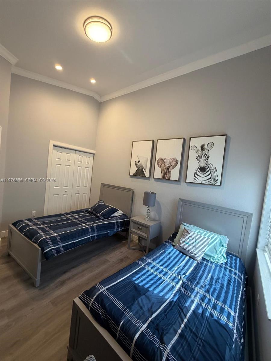 10285 Allegro Drive Boca Raton, FL 33428 - Photo 31 of 55 a bedroom with furniture and window