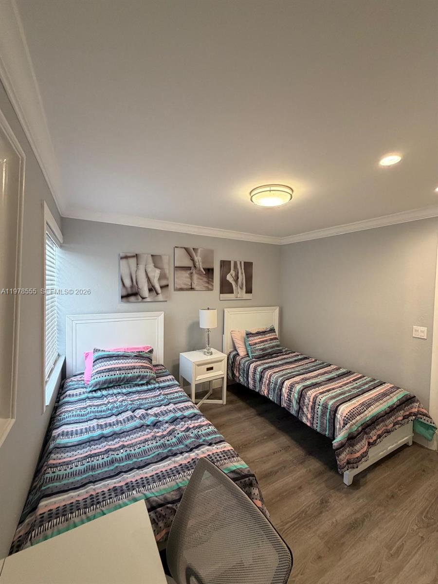 10285 Allegro Drive Boca Raton, FL 33428 - Photo 34 of 55 a bedroom with a bed and lamp