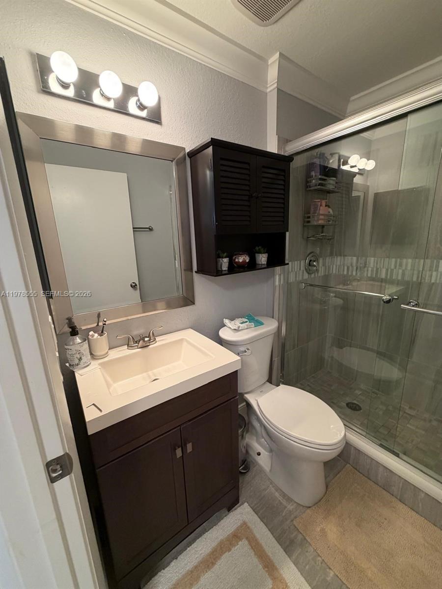 10285 Allegro Drive Boca Raton, FL 33428 - Photo 35 of 55 a bathroom with a double vanity sink mirror and toilet