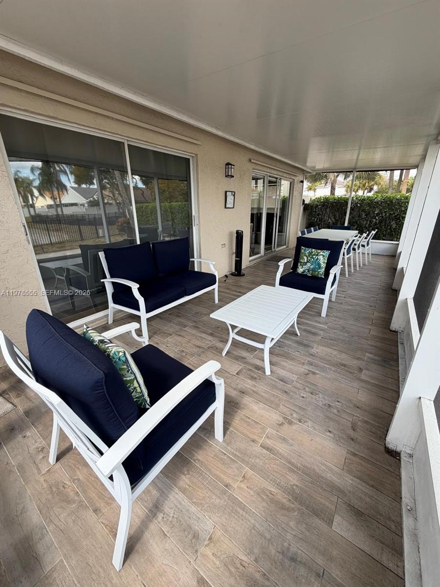 10285 Allegro Drive Boca Raton, FL 33428 - Photo 53 of 55 a living room with a couch and a table