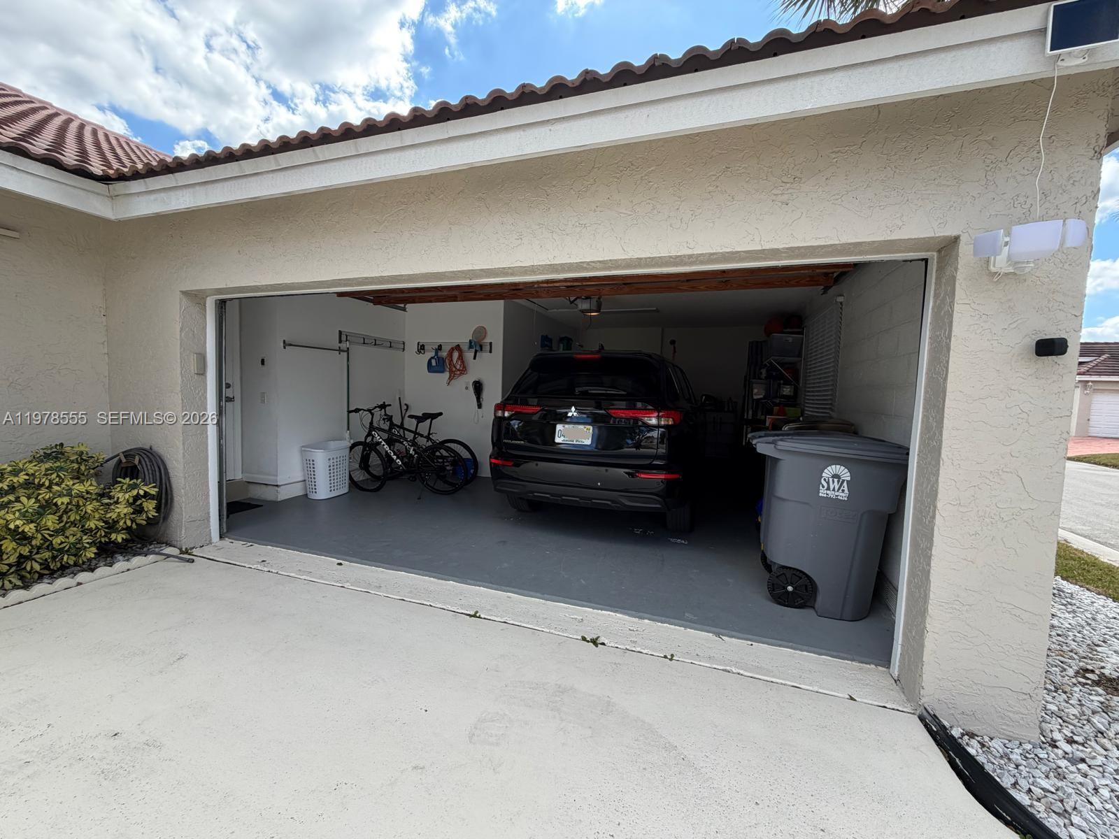 10285 Allegro Drive Boca Raton, FL 33428 - Photo 7 of 55 a view of car garage