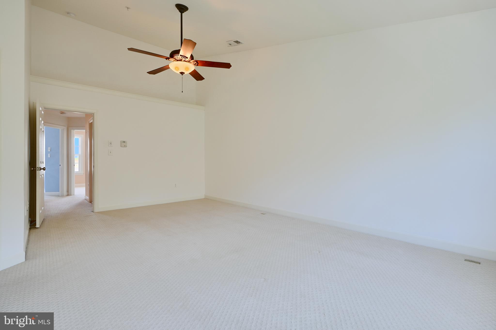 7570 Maidenhead Drive Hanover, MD 21076 - Photo 14 of 37 a view of a room with a hanging light and kitchen