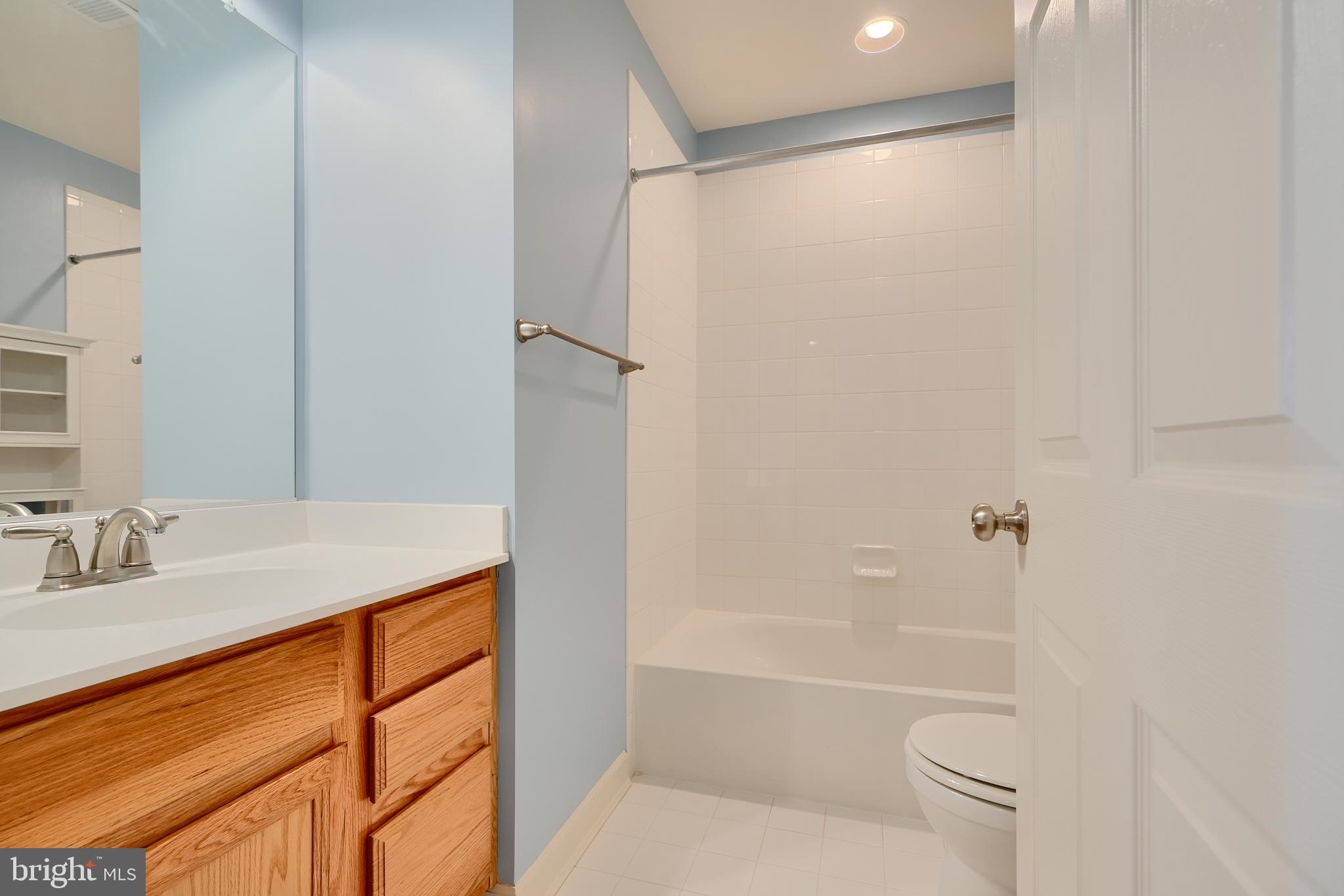 7570 Maidenhead Drive Hanover, MD 21076 - Photo 25 of 37 a bathroom with a granite countertop sink toilet and shower