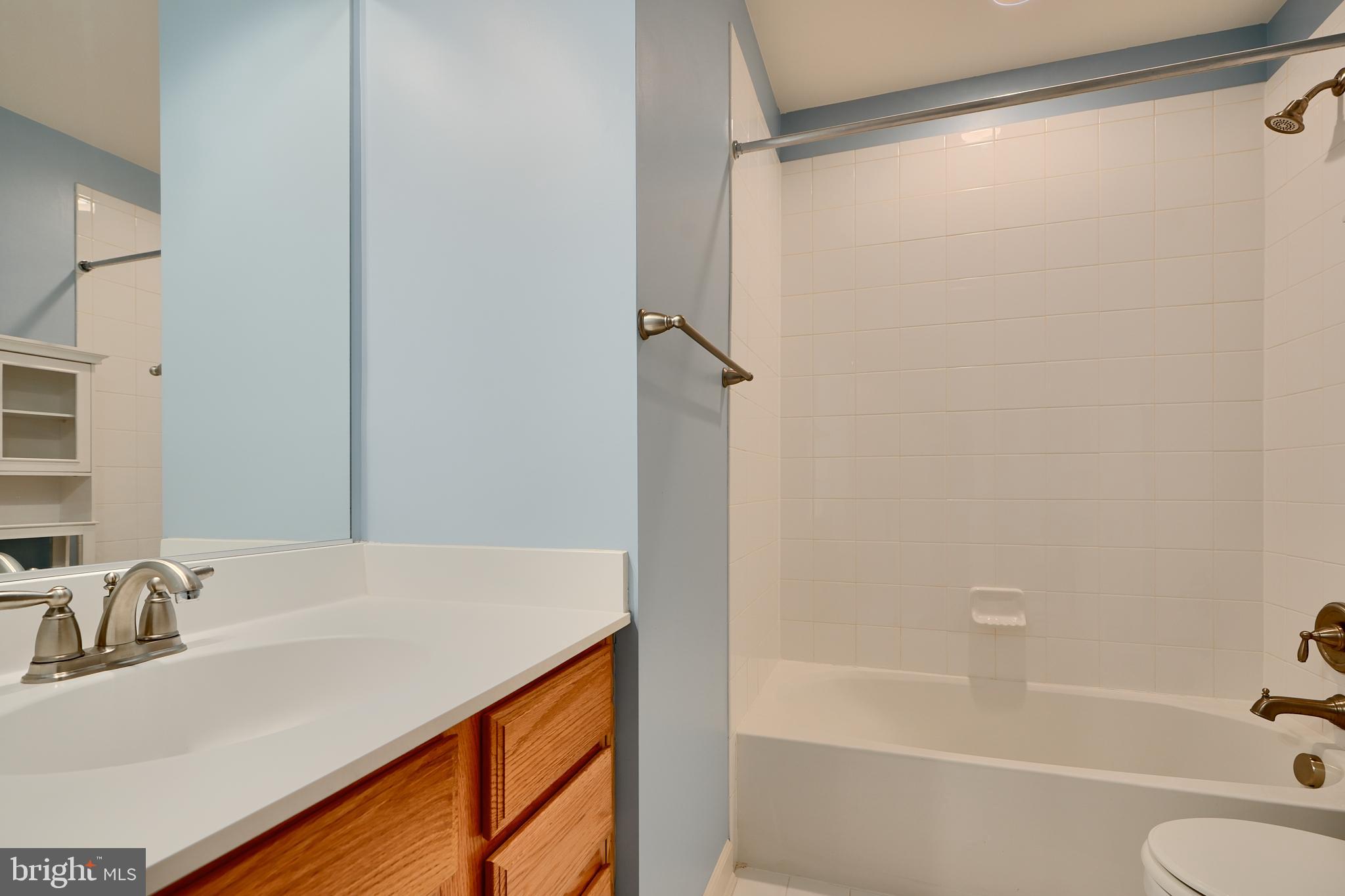 7570 Maidenhead Drive Hanover, MD 21076 - Photo 26 of 37 a bathroom with a granite countertop sink and a bathtub