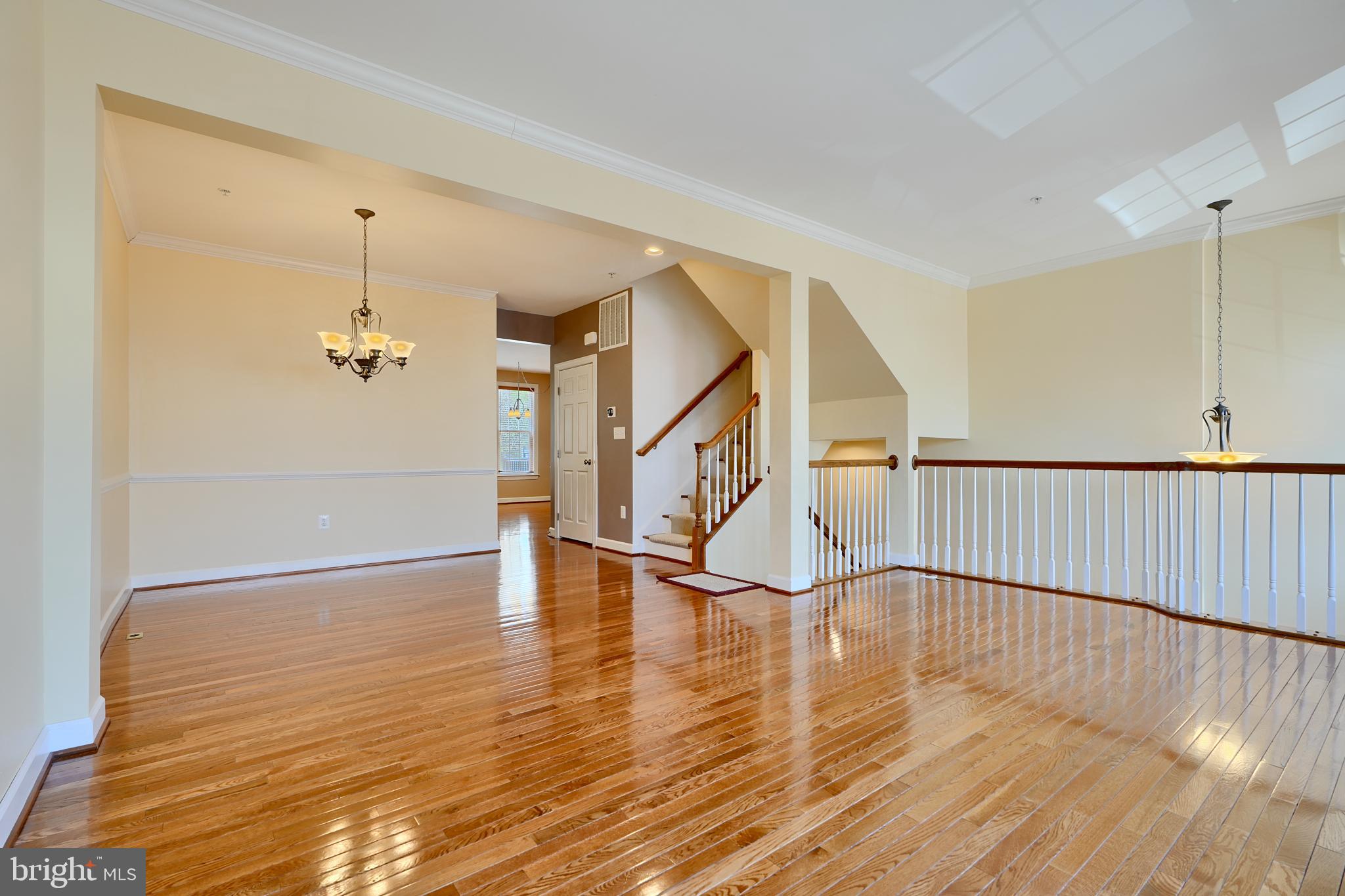 7570 Maidenhead Drive Hanover, MD 21076 - Photo 10 of 37 a view of entryway and hall with wooden floor
