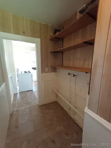 a view of an empty room and a window