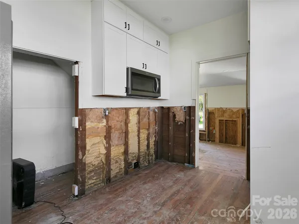a view of a livingroom with wooden floor