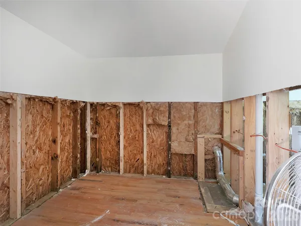 a view of a room with lots of wooden walls