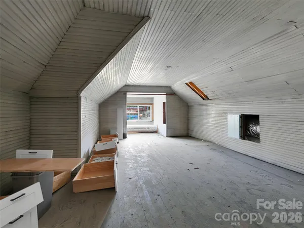 a balcony with furniture and a fireplace