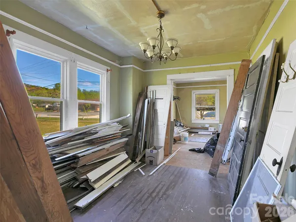 a view of a livingroom with furniture window and wooden floor