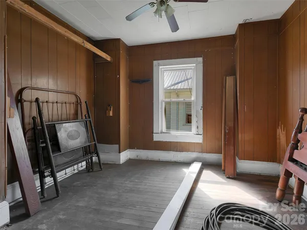 a view of a hallway with workspace and a mirror