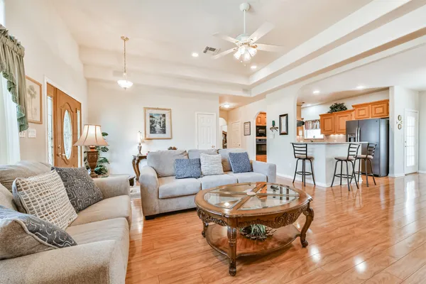 a living room with furniture fireplace and flat screen tv