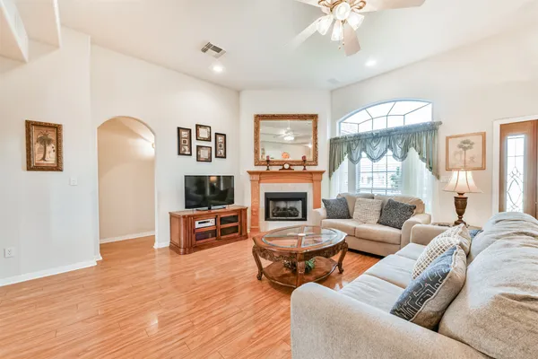 a living room with furniture and a fireplace