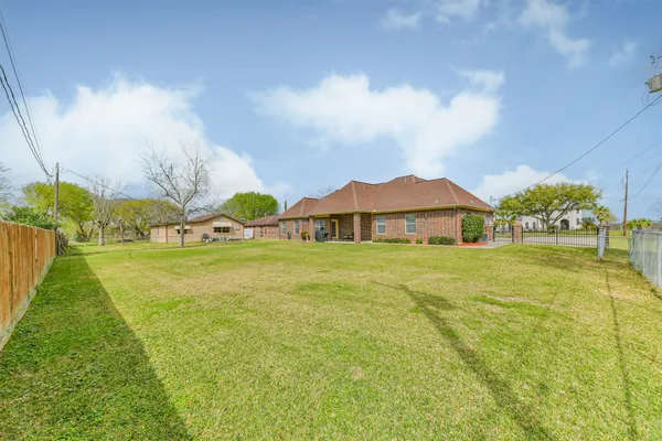 a aerial view of a house with a yard