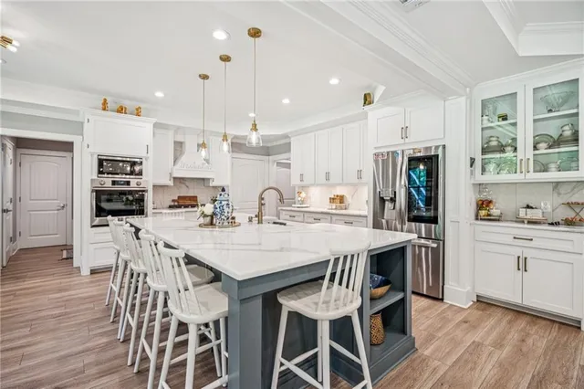 a spacious bathroom with a shower a mirror and a sink