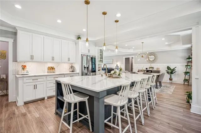 a bathroom with a glass shower door and a sink