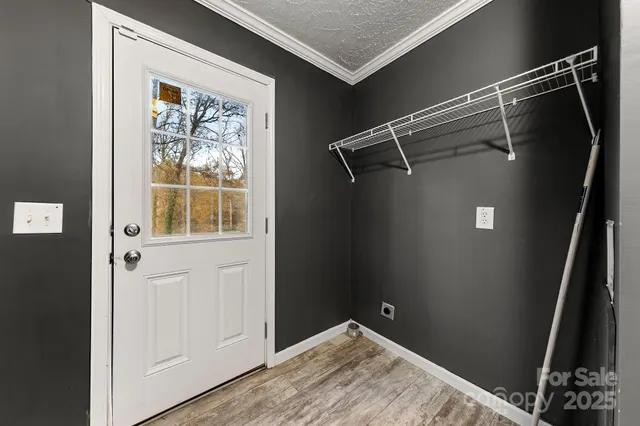 a bathroom with a glass shower door