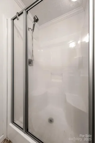 a bathroom with a granite countertop sink a large mirror a vanity and window