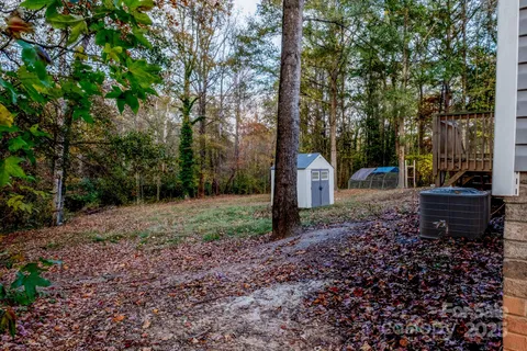 a view of a backyard with tree