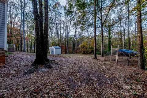 a backyard of a house with lots of green space