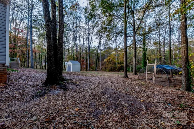 a backyard of a house with lots of green space