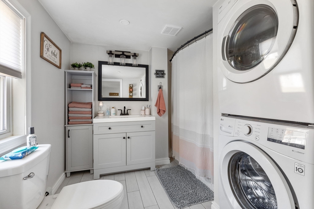 11 Mayflower Road Norton, MA 02766 - Photo 14 of 22 a spacious bathroom with a sink a washer and dryer