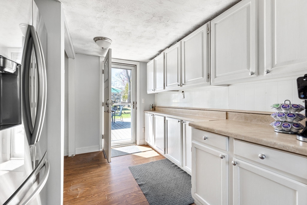 11 Mayflower Road Norton, MA 02766 - Photo 16 of 22 a kitchen with stainless steel appliances granite countertop a refrigerator and white cabinets