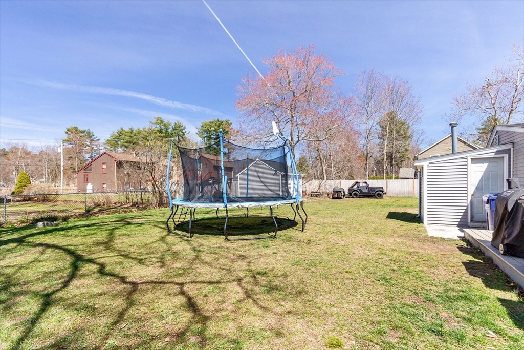 11 Mayflower Road Norton, MA 02766 - Photo 19 of 22 a view of a backyard with a garden and entertaining space