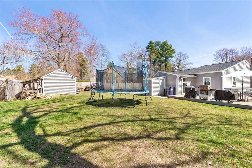 11 Mayflower Road Norton, MA 02766 - Photo 20 of 22 a swimming pool with trees in front of it