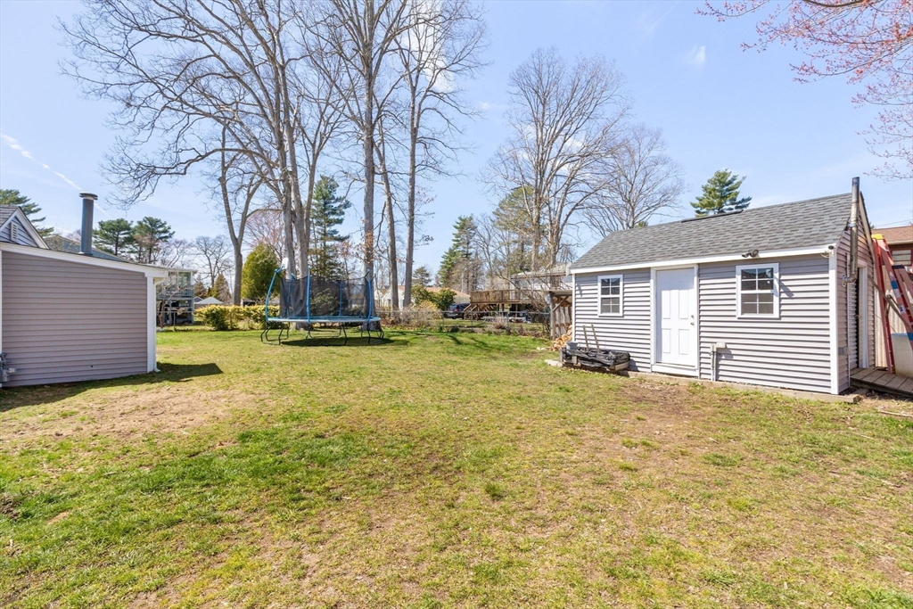 11 Mayflower Road Norton, MA 02766 - Photo 21 of 22 a view of a yard with a house