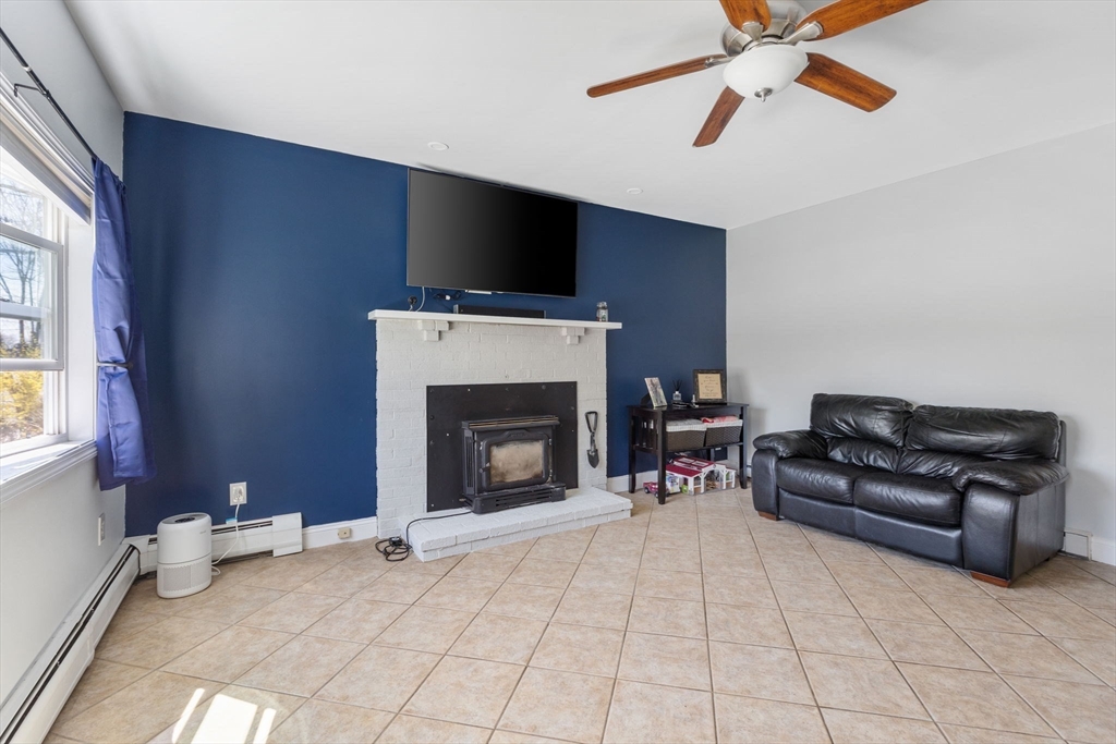 11 Mayflower Road Norton, MA 02766 - Photo 4 of 22 a living room with furniture and a fireplace