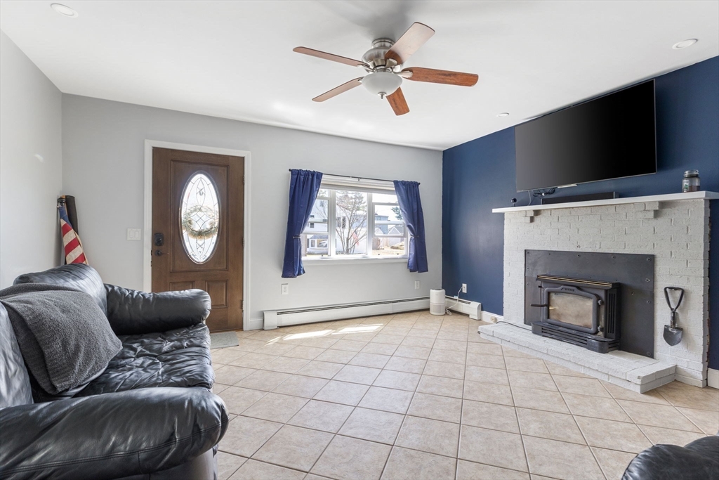 11 Mayflower Road Norton, MA 02766 - Photo 5 of 22 a living room with furniture and a fireplace