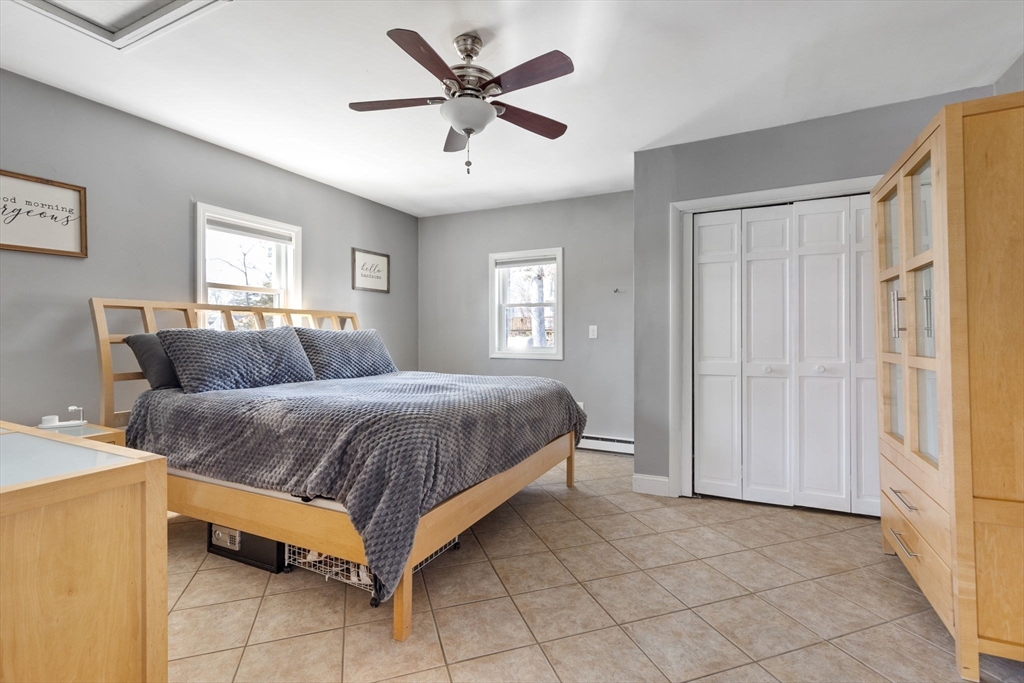 11 Mayflower Road Norton, MA 02766 - Photo 6 of 22 a spacious bedroom with a bed and window