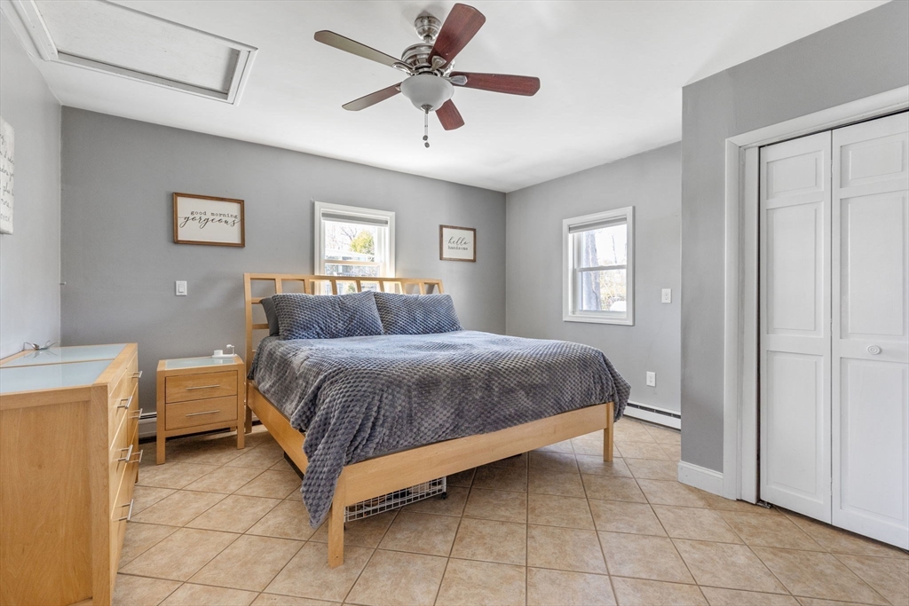 11 Mayflower Road Norton, MA 02766 - Photo 7 of 22 a spacious bedroom with a bed and window